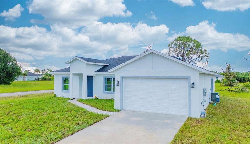 46 Master Drive Placida, FL 33946 - Photo 2 of 44 a view of a house with a yard and potted plants