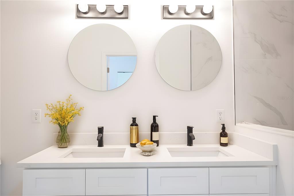 46 Master Drive Placida, FL 33946 - Photo 25 of 44 a bathroom with a sink and a mirror