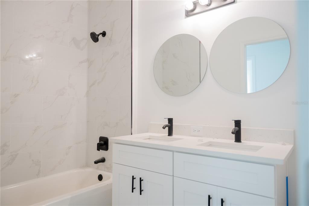 46 Master Drive Placida, FL 33946 - Photo 30 of 44 a bathroom with a sink and a mirror