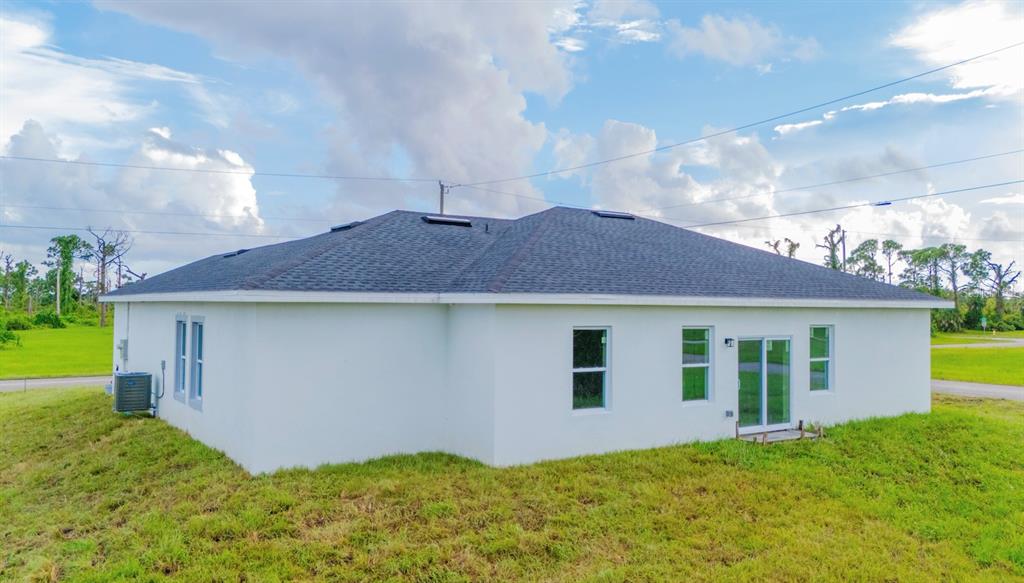 46 Master Drive Placida, FL 33946 - Photo 3 of 44 a house view with a garden space