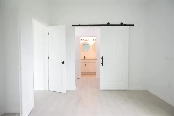 a kitchen with kitchen island a sink stove and refrigerator