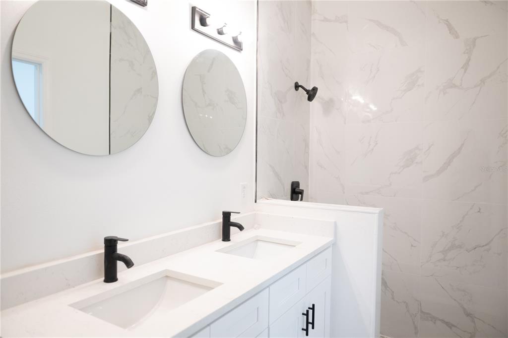 46 Master Drive Placida, FL 33946 - Photo 37 of 44 a bathroom with a sink and a mirror