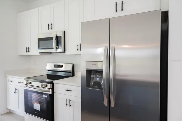 a kitchen with a sink and a window