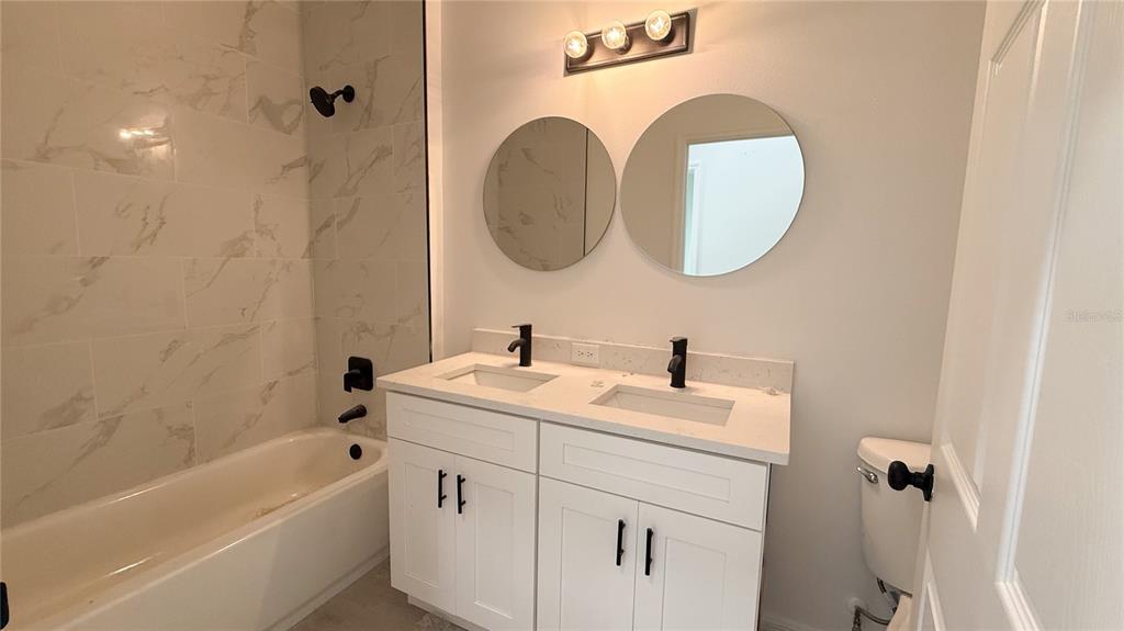 46 Master Drive Placida, FL 33946 - Photo 42 of 44 a bathroom with a sink and a mirror