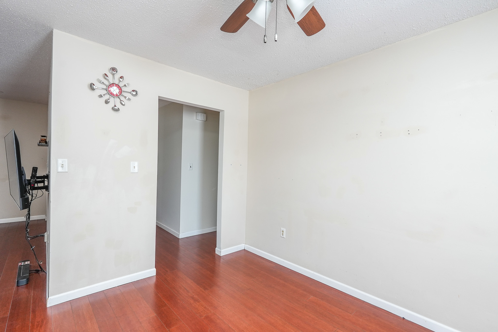 165 East Baker Street Manteno, IL 60950 - Photo 12 of 38 an empty room with wooden floor and cabinet
