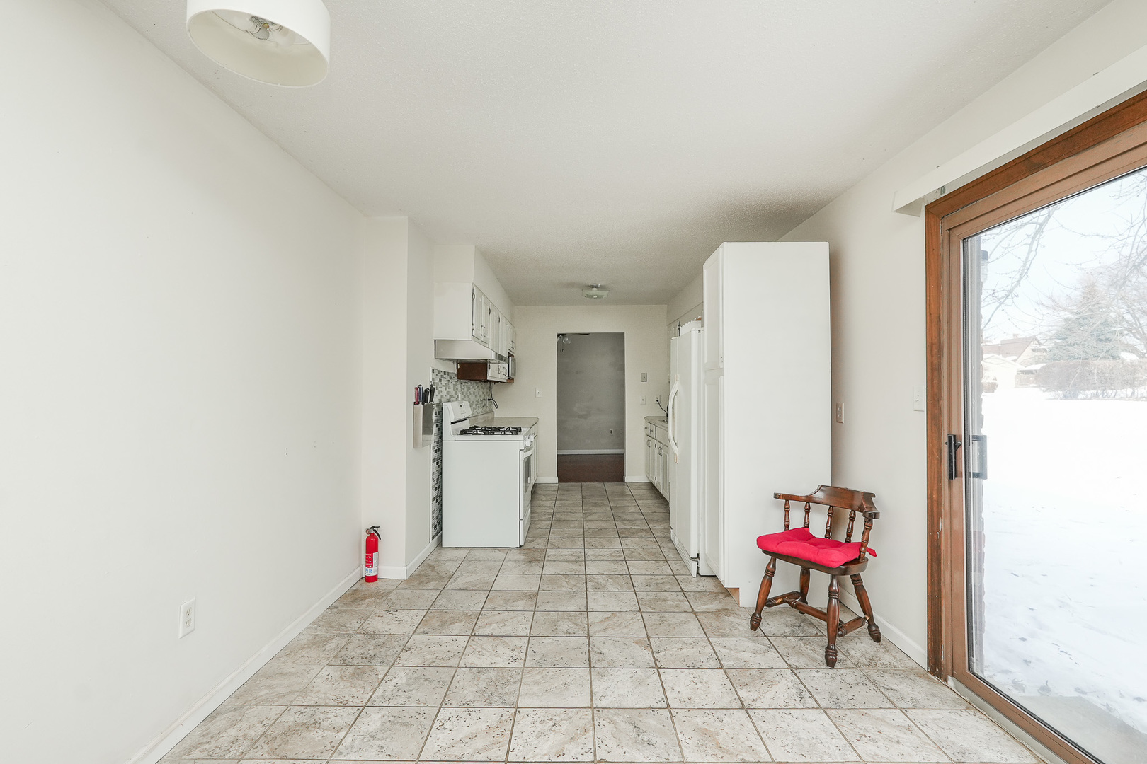 165 East Baker Street Manteno, IL 60950 - Photo 20 of 38 a room with a table and a chair