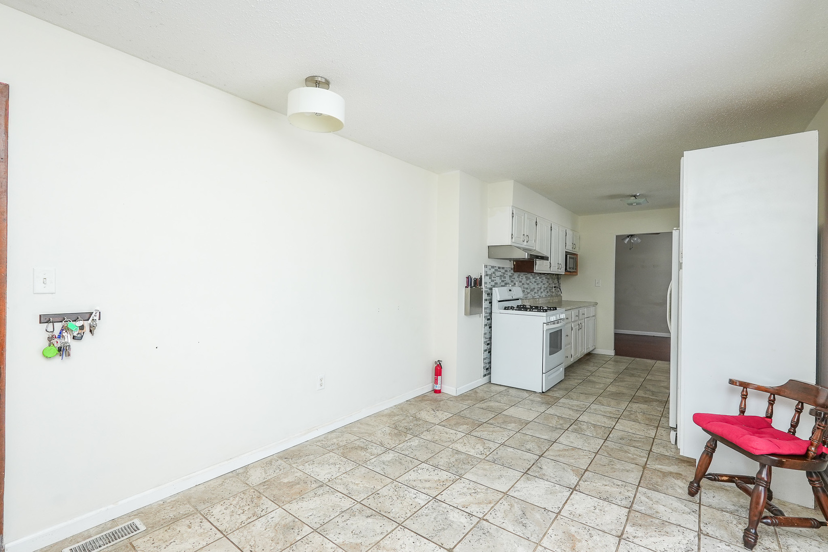 165 East Baker Street Manteno, IL 60950 - Photo 21 of 38 a kitchen with a sink cabinets and wooden floor