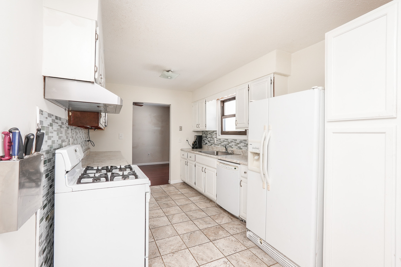 165 East Baker Street Manteno, IL 60950 - Photo 23 of 38 a kitchen with a refrigerator and a stove