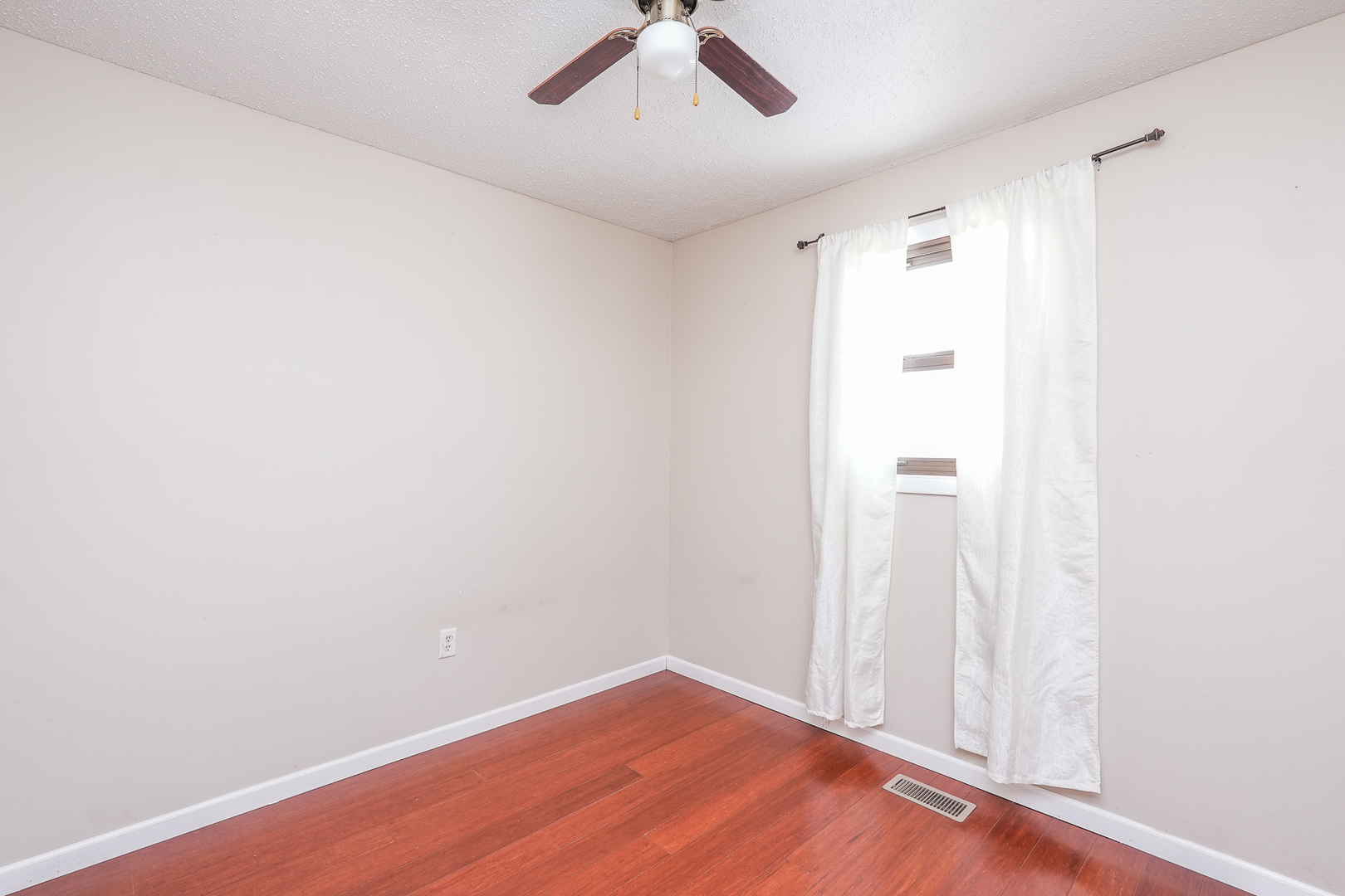 165 East Baker Street Manteno, IL 60950 - Photo 27 of 38 an empty room with a ceiling fan and carpet