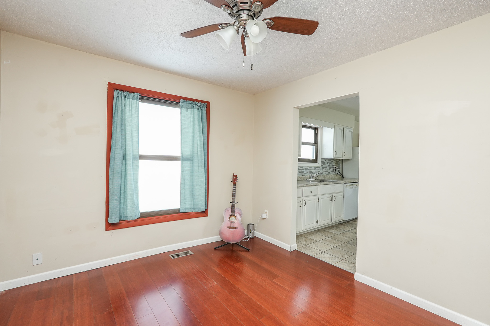 165 East Baker Street Manteno, IL 60950 - Photo 9 of 38 an empty room with windows and ceiling fan