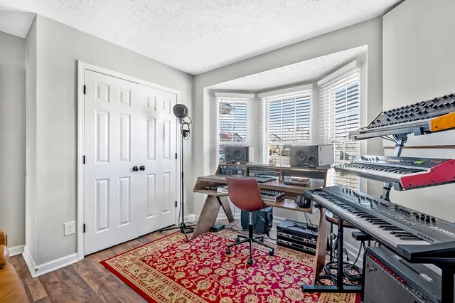 a workspace with furniture and rug