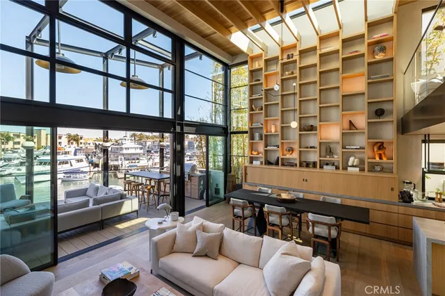 a view of a dining room with furniture and floor to ceiling window