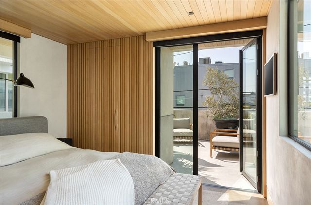 a view of a patio with couches and a fire pit