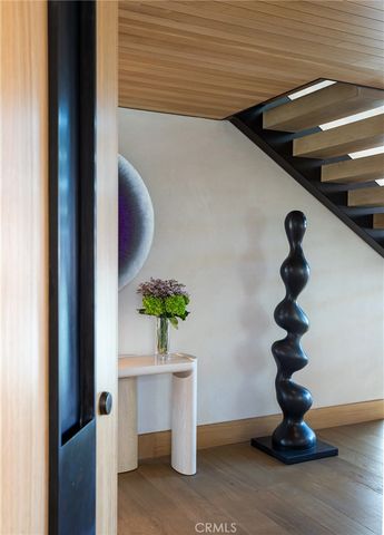 a living room with furniture a large window and a fireplace