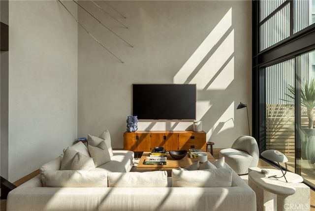 a living room with a table and chairs