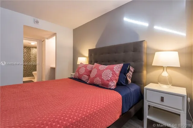 a bathroom with a toilet a sink and a mirror