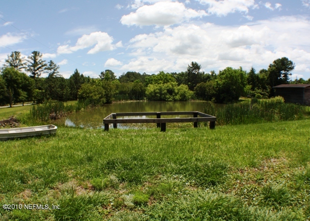 54178 Snyder Road Callahan, FL 32011 - Photo 2 of 14 a view of a lake with a yard