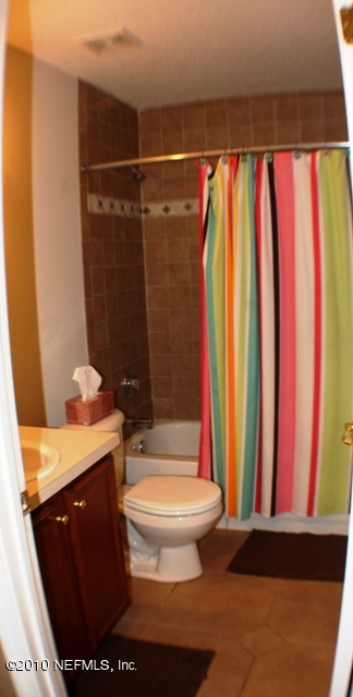 54178 Snyder Road Callahan, FL 32011 - Photo 10 of 14 a bathroom with a sink toilet and shower