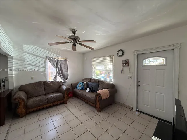 a living room with furniture and a window