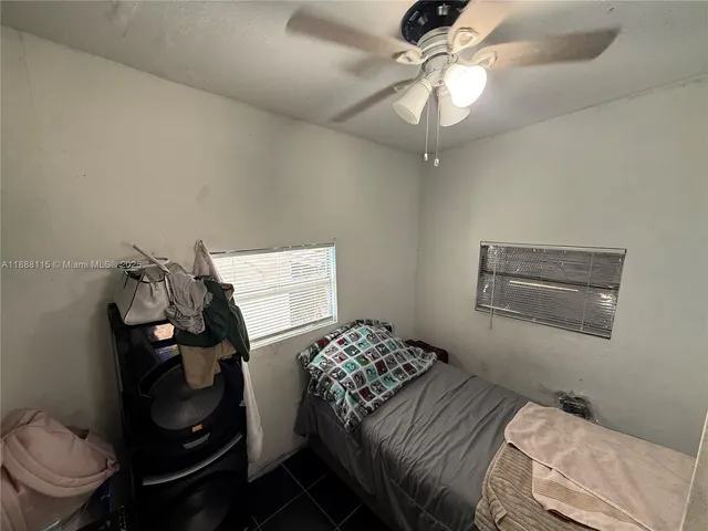 a view of utility room and bedroom