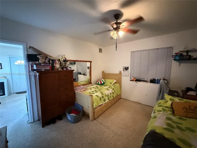 a bedroom with furniture and a chandelier