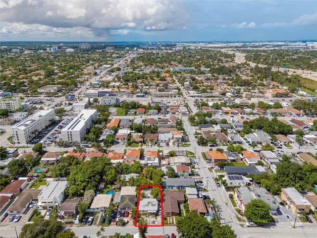 a view of a car park in front of a house