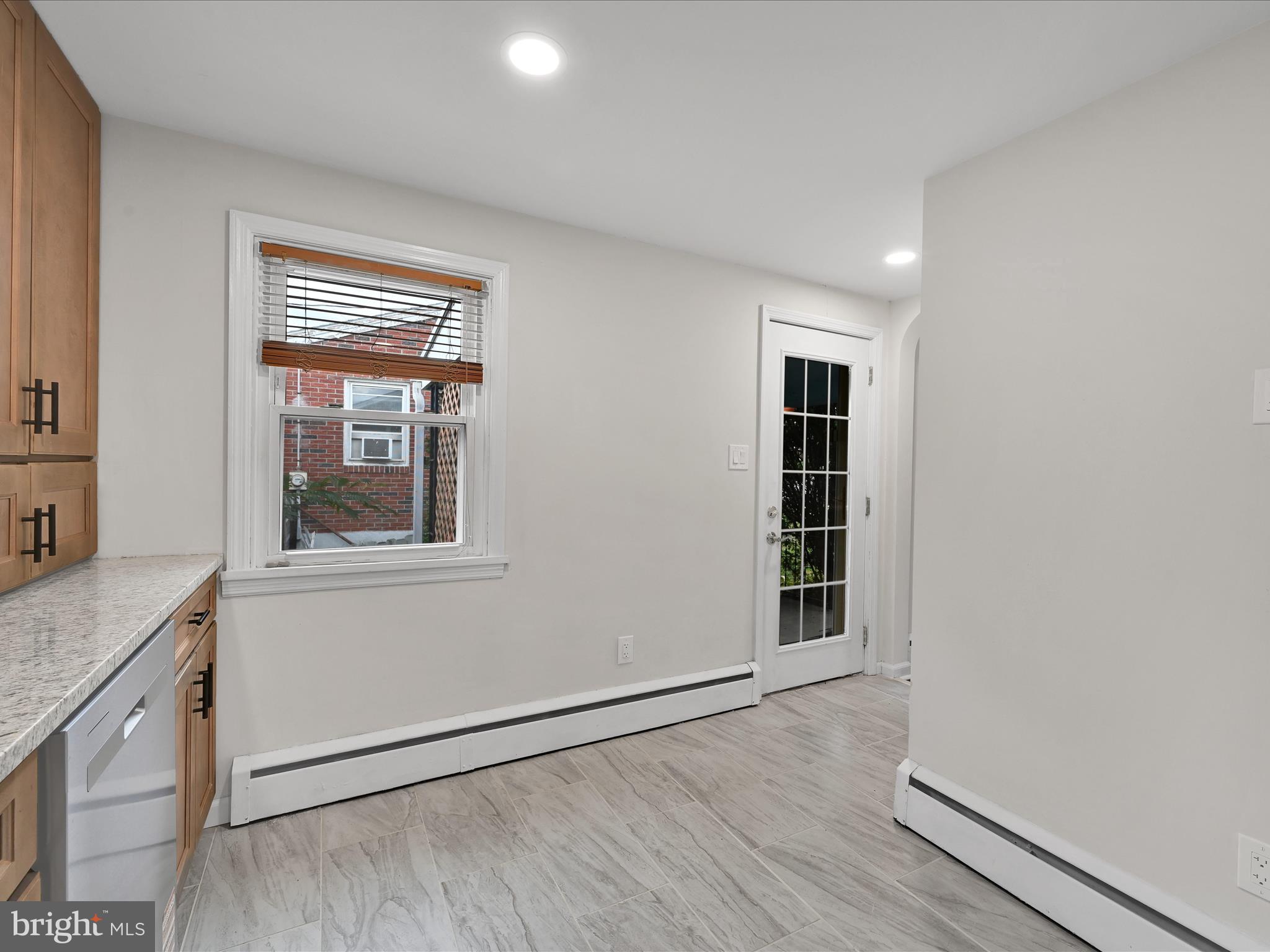 1609 Fayette Avenue Reading, PA 19607 - Photo 15 of 27 a view of an empty room with wooden floor and a window