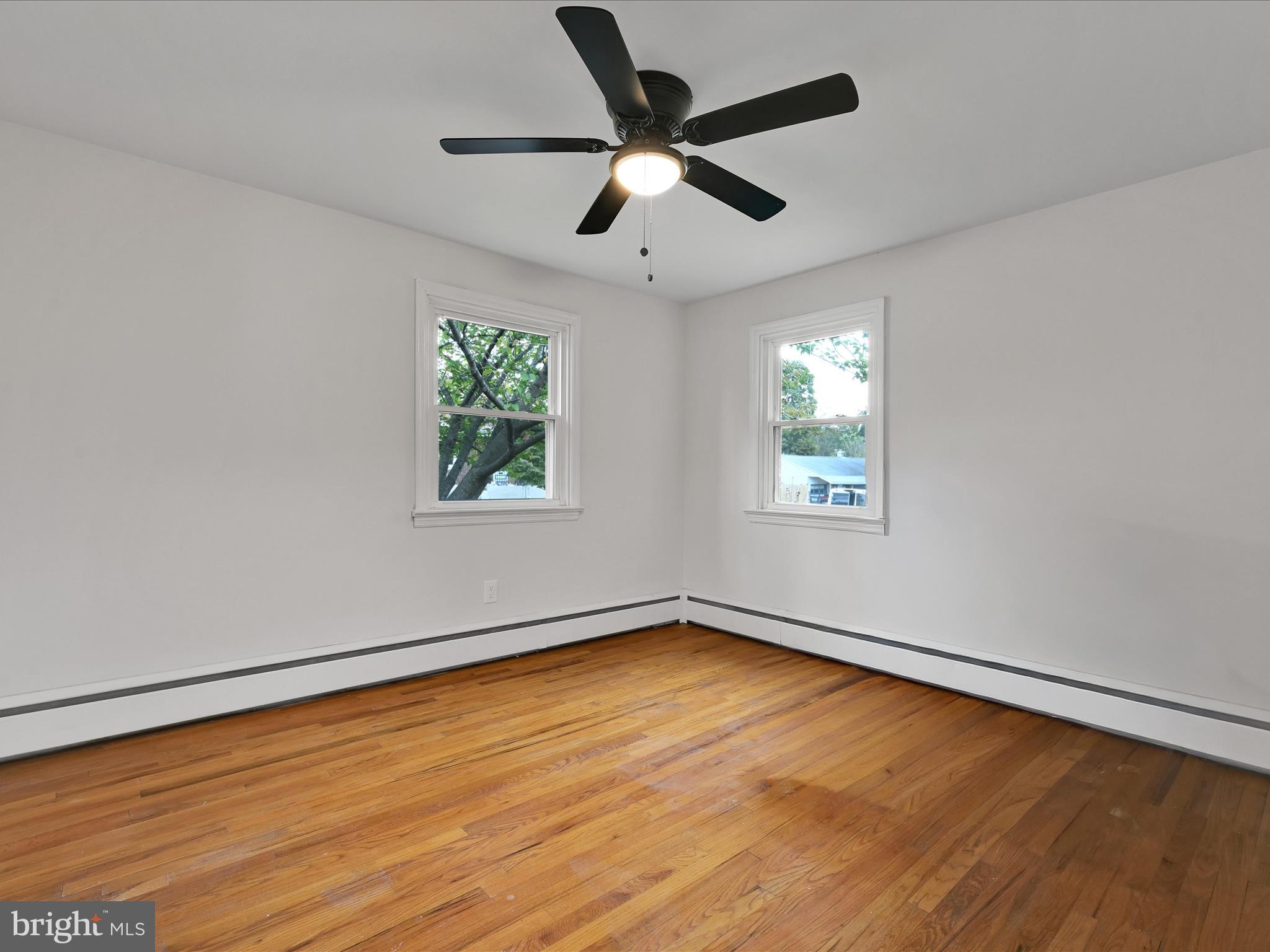 1609 Fayette Avenue Reading, PA 19607 - Photo 16 of 27 wooden floor in an empty room with a window