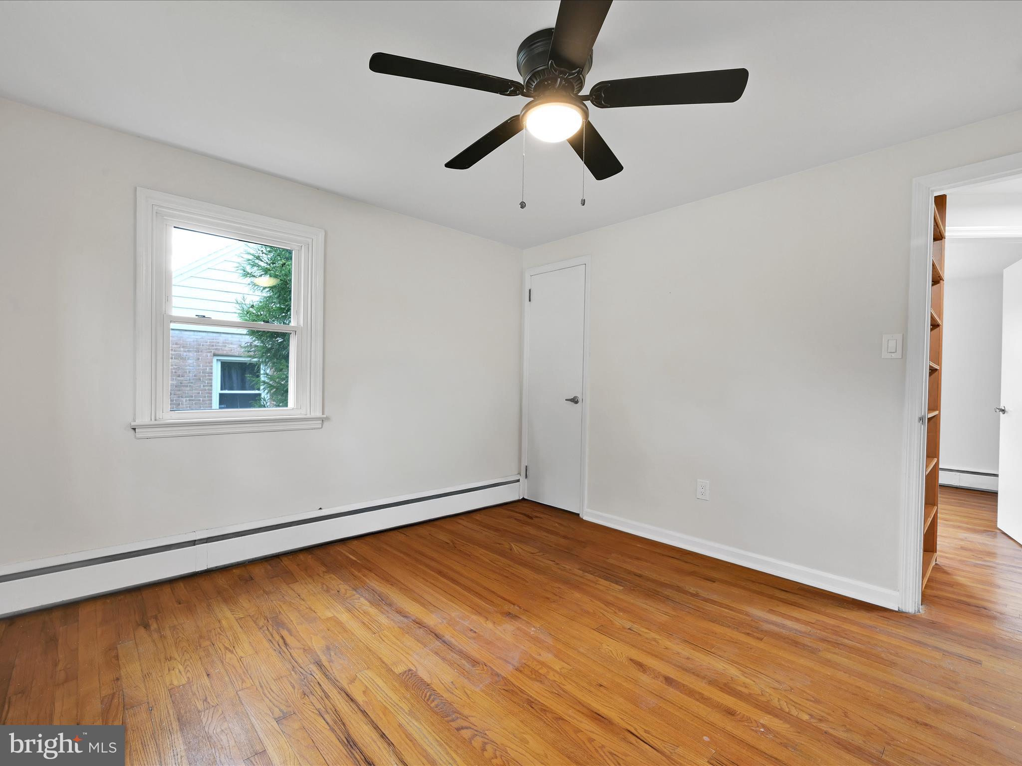 1609 Fayette Avenue Reading, PA 19607 - Photo 17 of 27 a view of empty room with wooden floor and fan