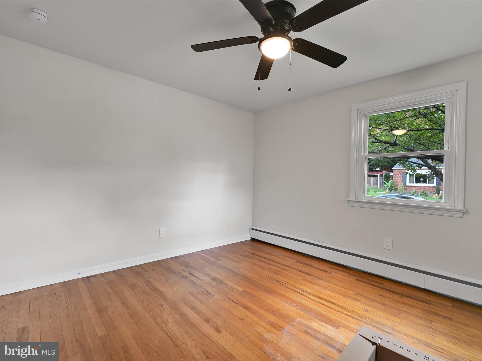 1609 Fayette Avenue Reading, PA 19607 - Photo 19 of 27 an empty room with a window and a ceiling fan
