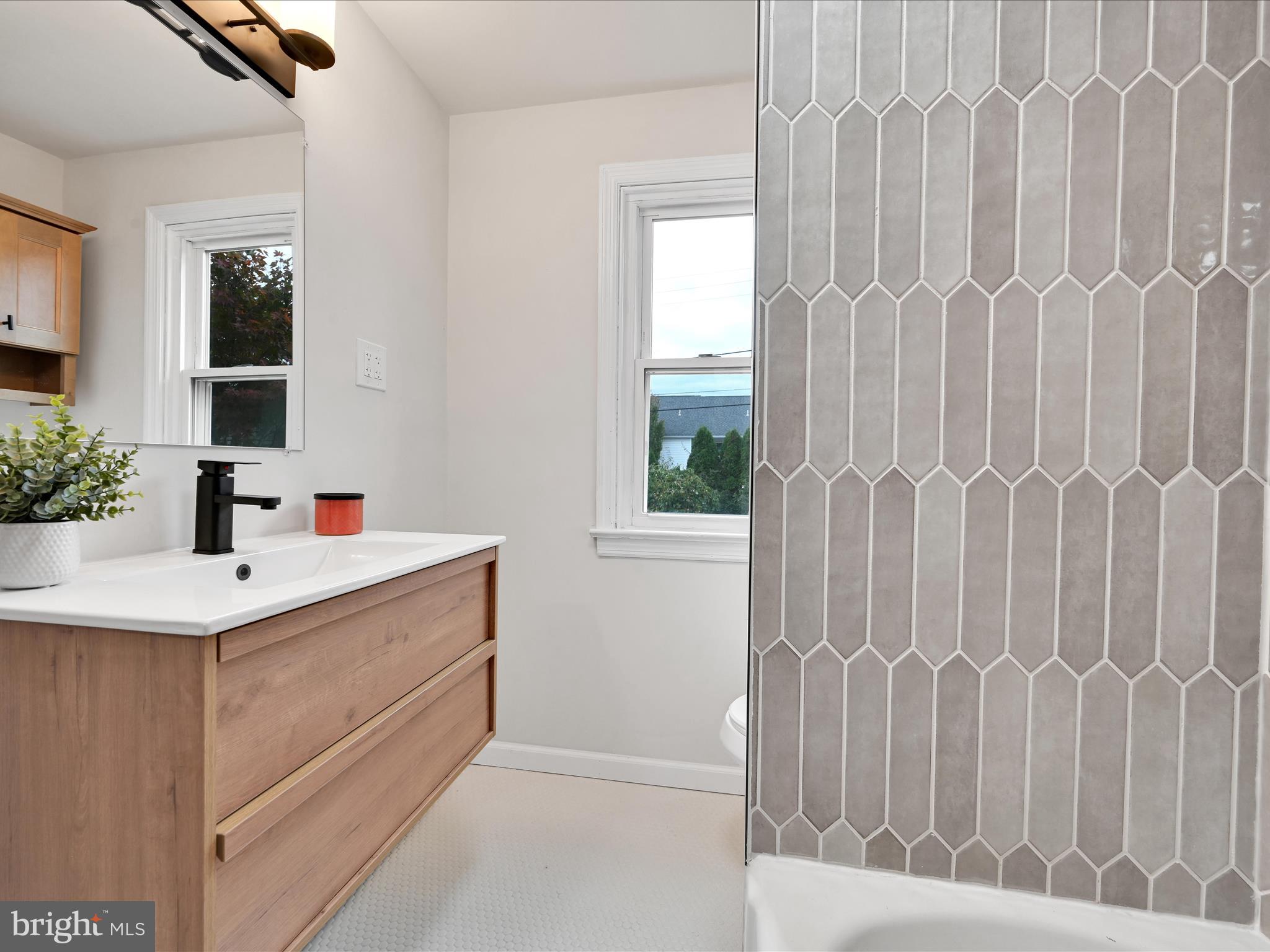 1609 Fayette Avenue Reading, PA 19607 - Photo 21 of 27 a bathroom with a sink and a mirror