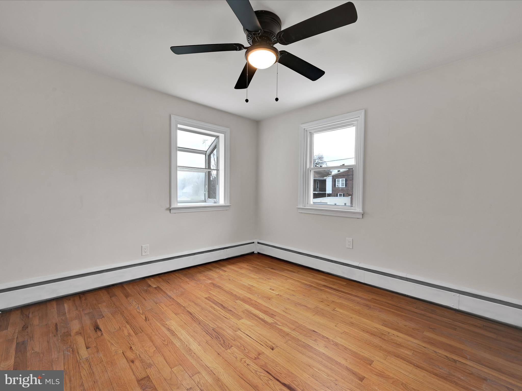 1609 Fayette Avenue Reading, PA 19607 - Photo 23 of 27 a view of an empty room with wooden floor and a window