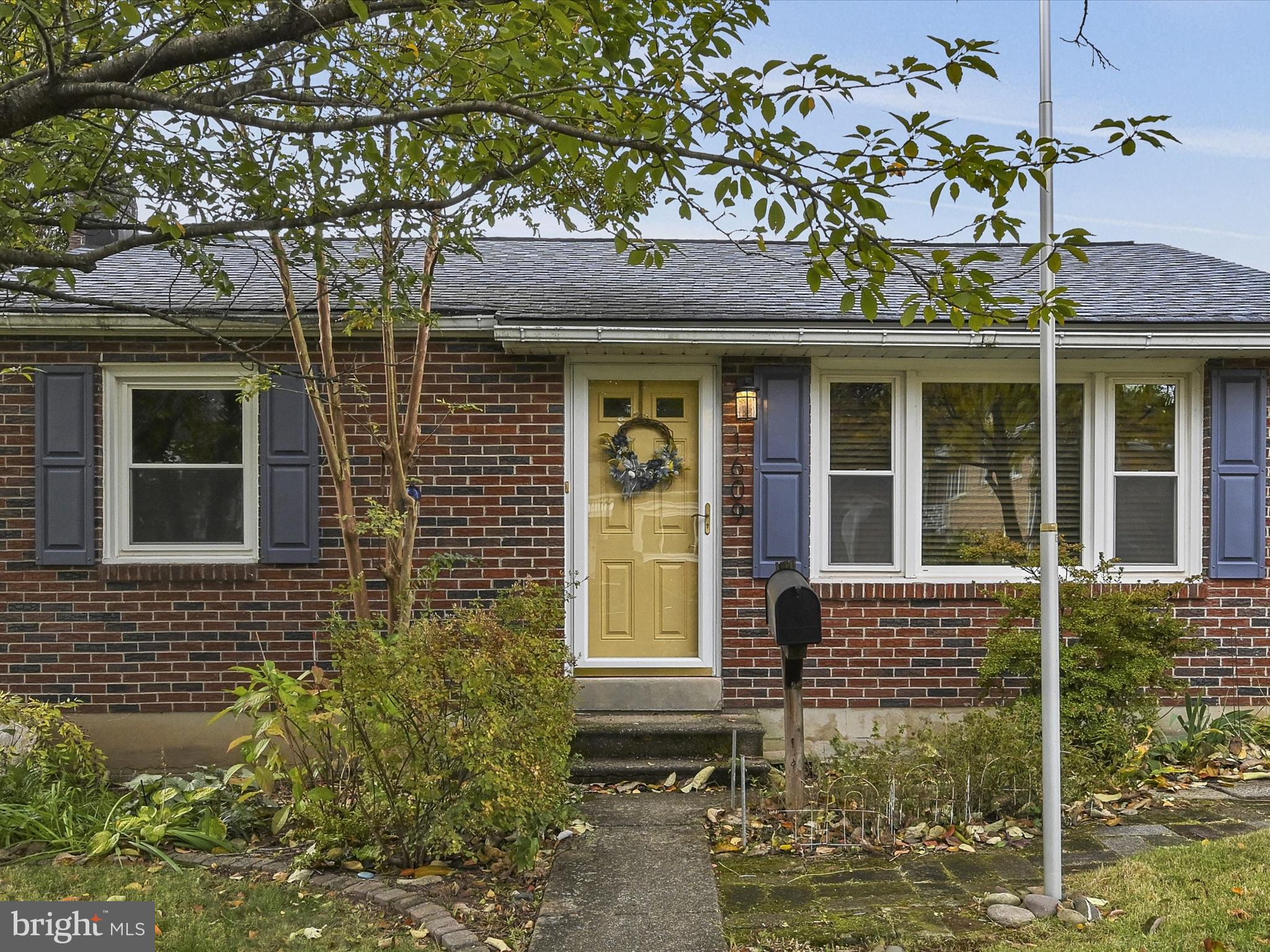 1609 Fayette Avenue Reading, PA 19607 - Photo 3 of 27 front view of a brick house with a large window