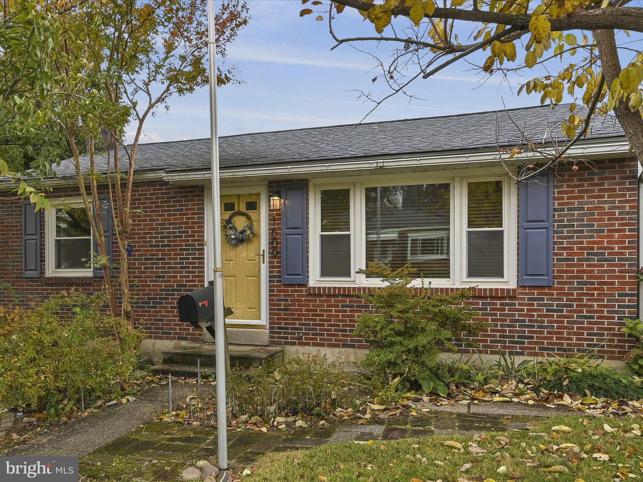 1609 Fayette Avenue Reading, PA 19607 - Photo 5 of 27 front view of a brick house with a large windows