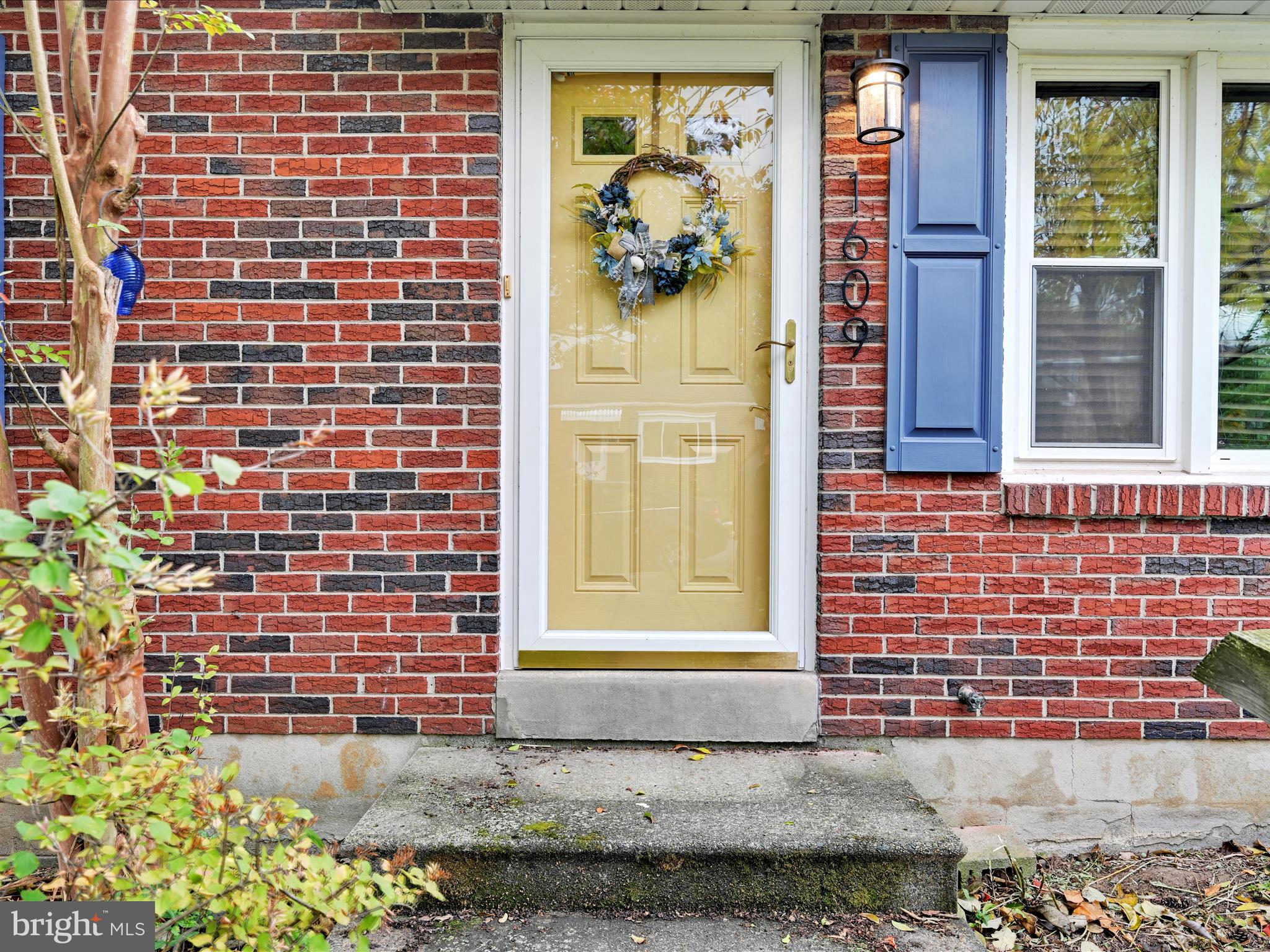 1609 Fayette Avenue Reading, PA 19607 - Photo 6 of 27 a view of a brick house with a window
