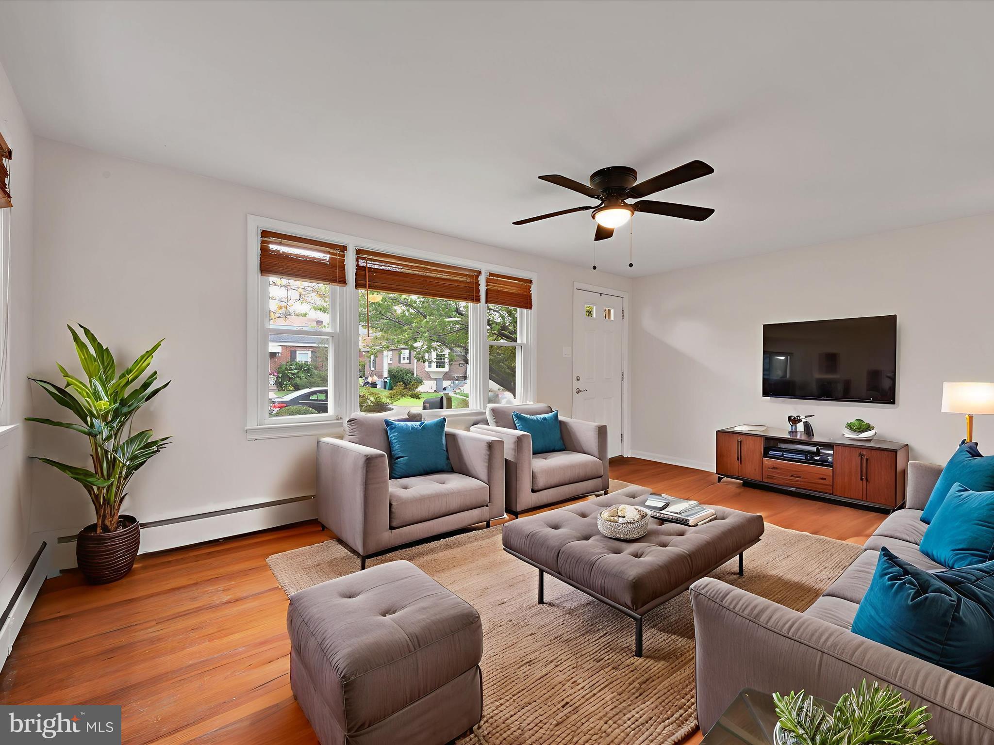 1609 Fayette Avenue Reading, PA 19607 - Photo 7 of 27 a living room with furniture a flat screen tv and a large window