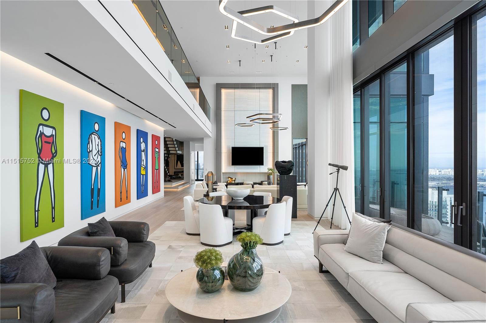 1451 Brickell Avenue, Unit PH56 Miami, FL 33131 - Photo 11 of 54 a living room with furniture fireplace and a large window