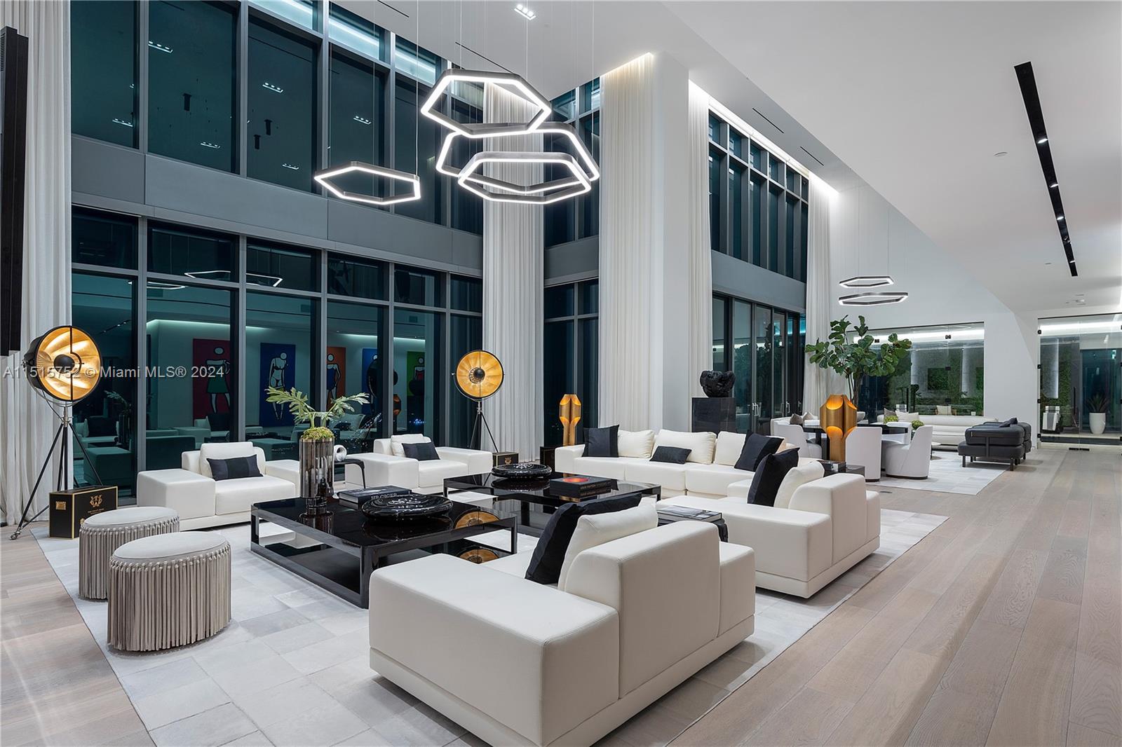 1451 Brickell Avenue, Unit PH56 Miami, FL 33131 - Photo 14 of 54 a living room with furniture a fireplace and a large window