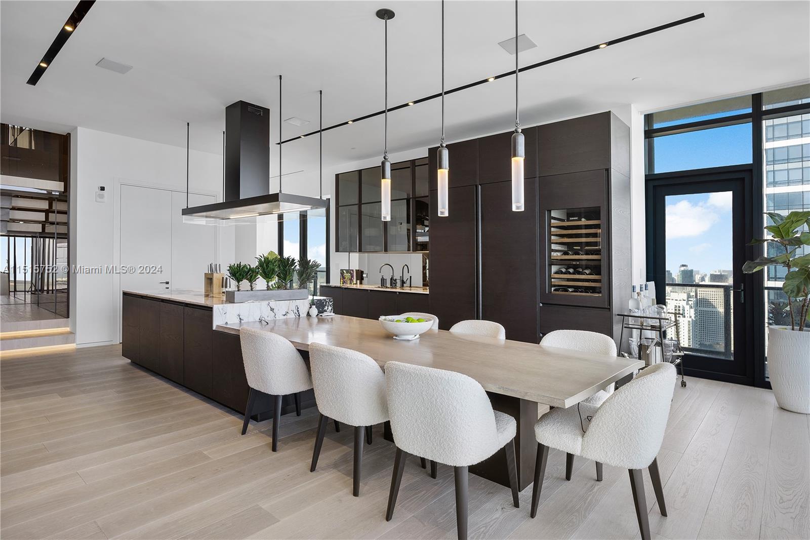 1451 Brickell Avenue, Unit PH56 Miami, FL 33131 - Photo 18 of 54 a view of a dining room with furniture