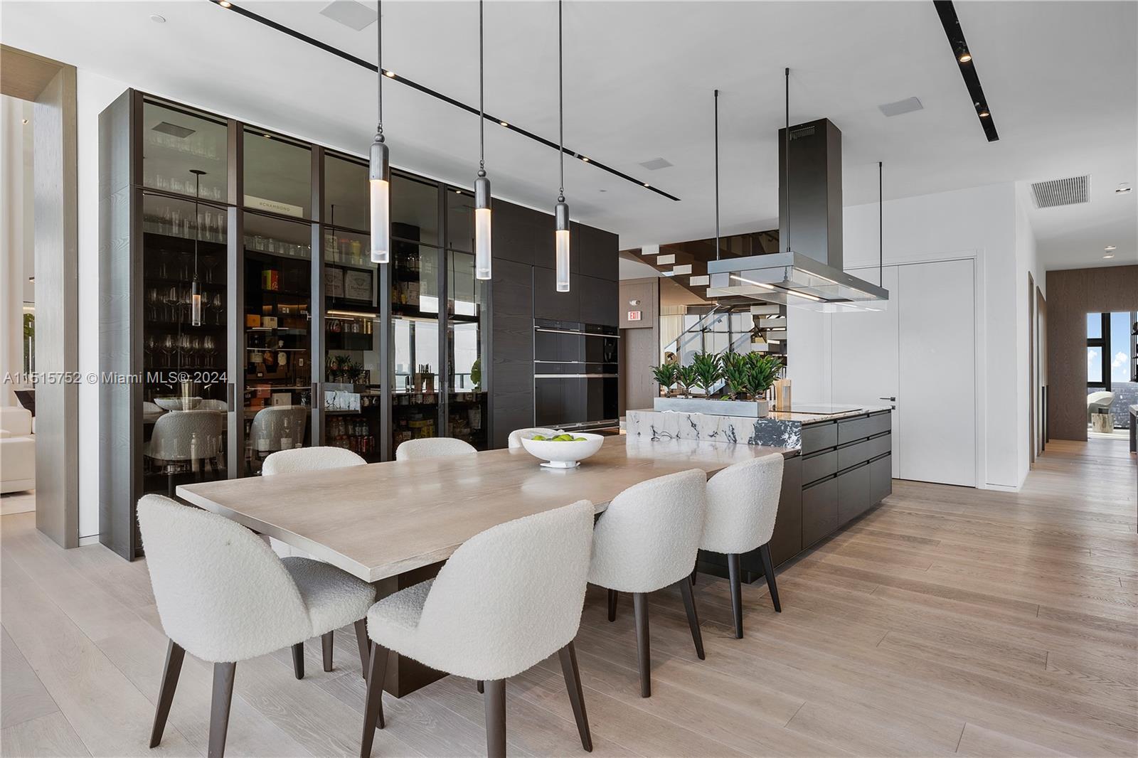 1451 Brickell Avenue, Unit PH56 Miami, FL 33131 - Photo 19 of 54 a view of a dining room with furniture