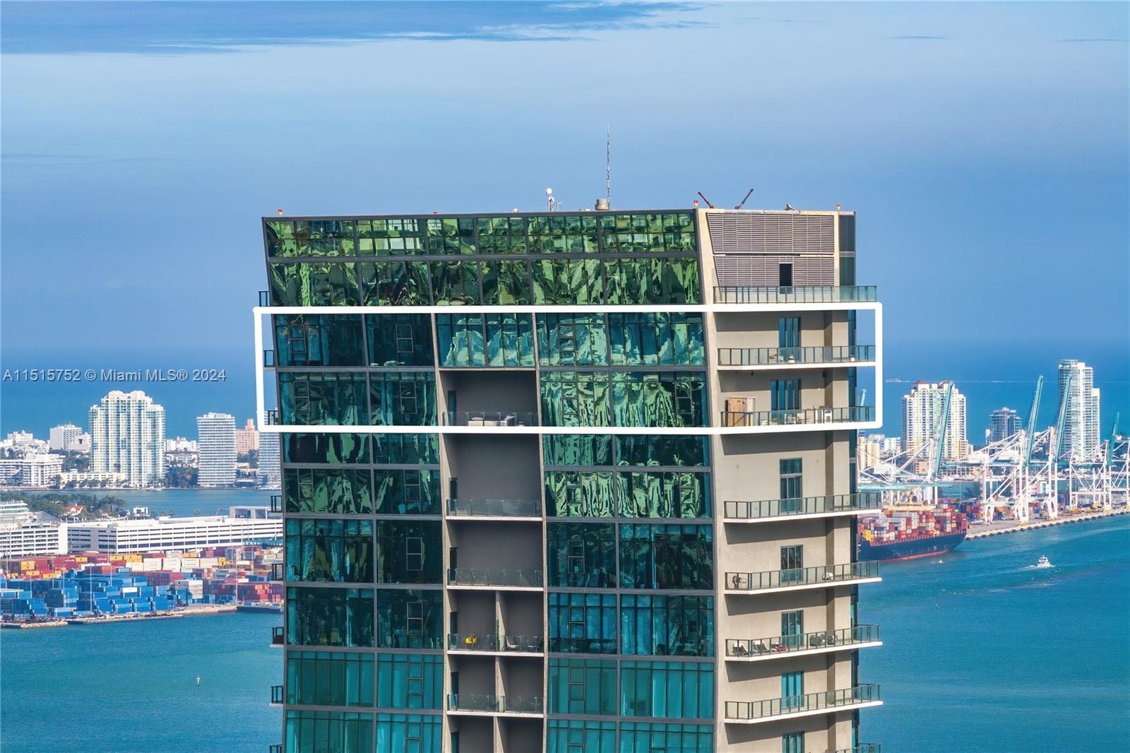 1451 Brickell Avenue, Unit PH56 Miami, FL 33131 - Photo 2 of 54 a view of a book shelf with wooden floor