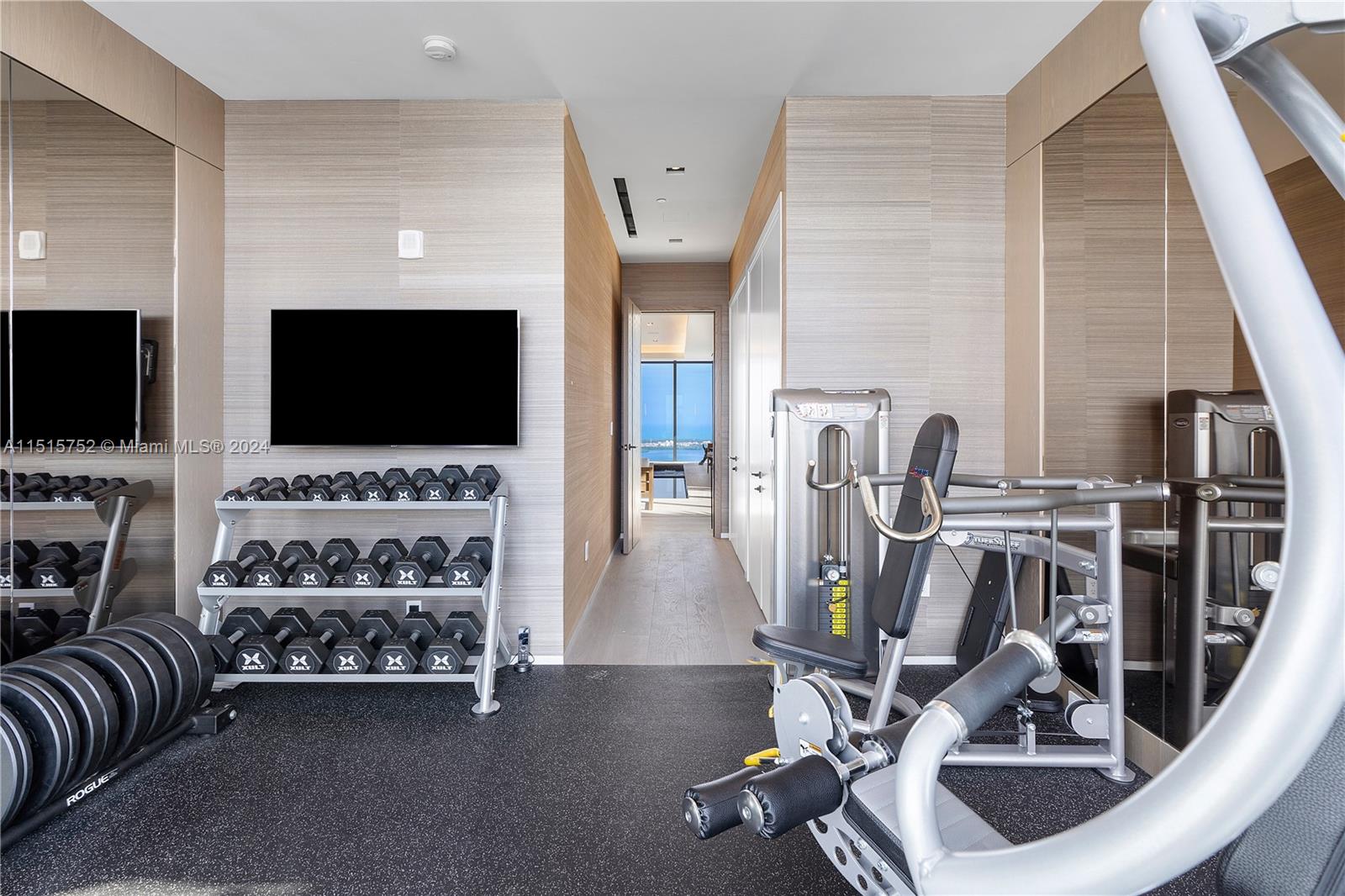 1451 Brickell Avenue, Unit PH56 Miami, FL 33131 - Photo 22 of 54 a view of a livingroom with furniture and a flat screen tv