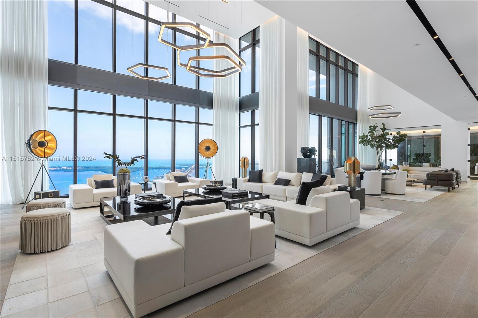 1451 Brickell Avenue, Unit PH56 Miami, FL 33131 - Photo 3 of 54 a living room with furniture or fireplace and a floor to ceiling window