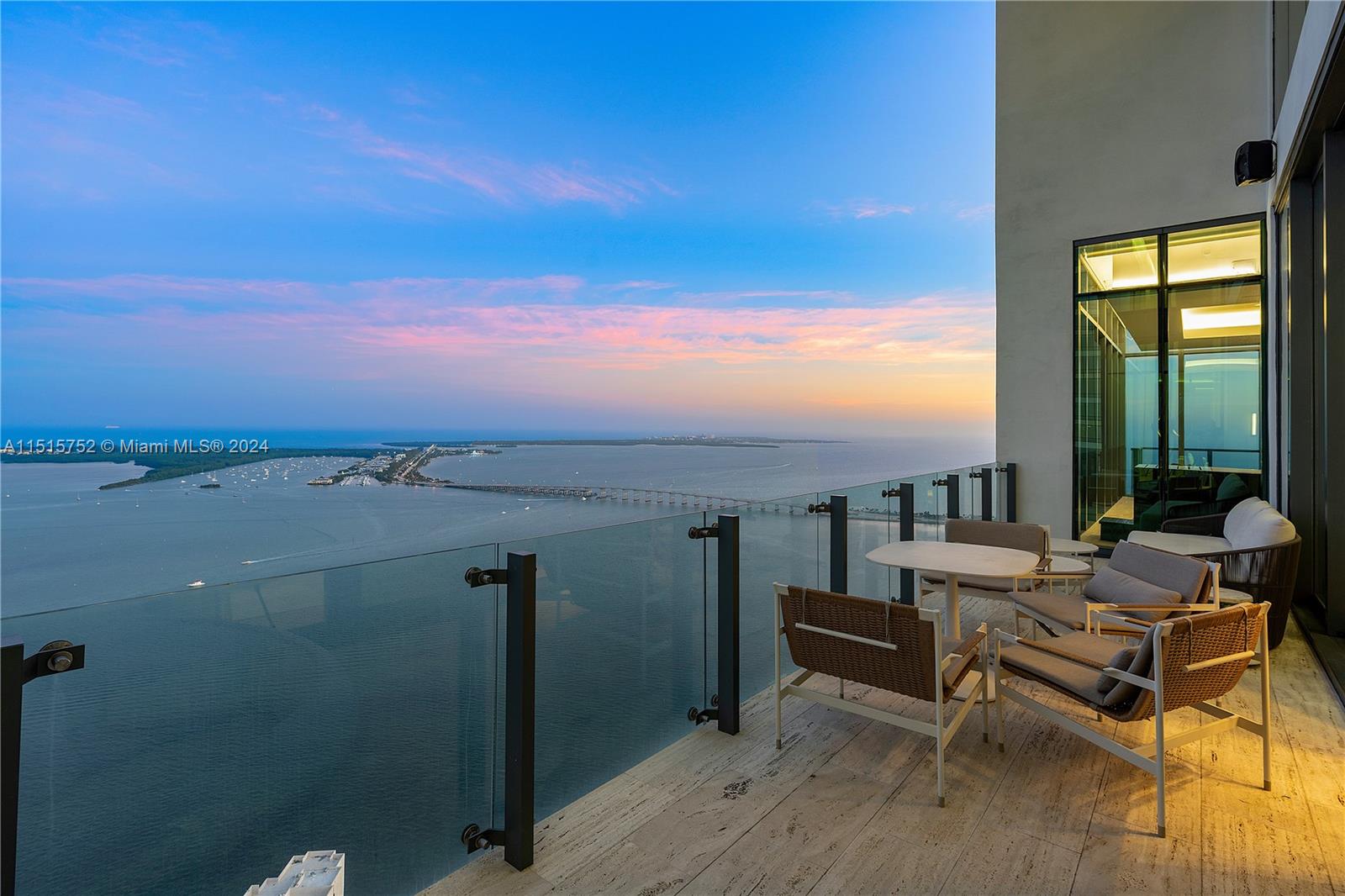 1451 Brickell Avenue, Unit PH56 Miami, FL 33131 - Photo 47 of 54 a terrace with outdoor seating and city view