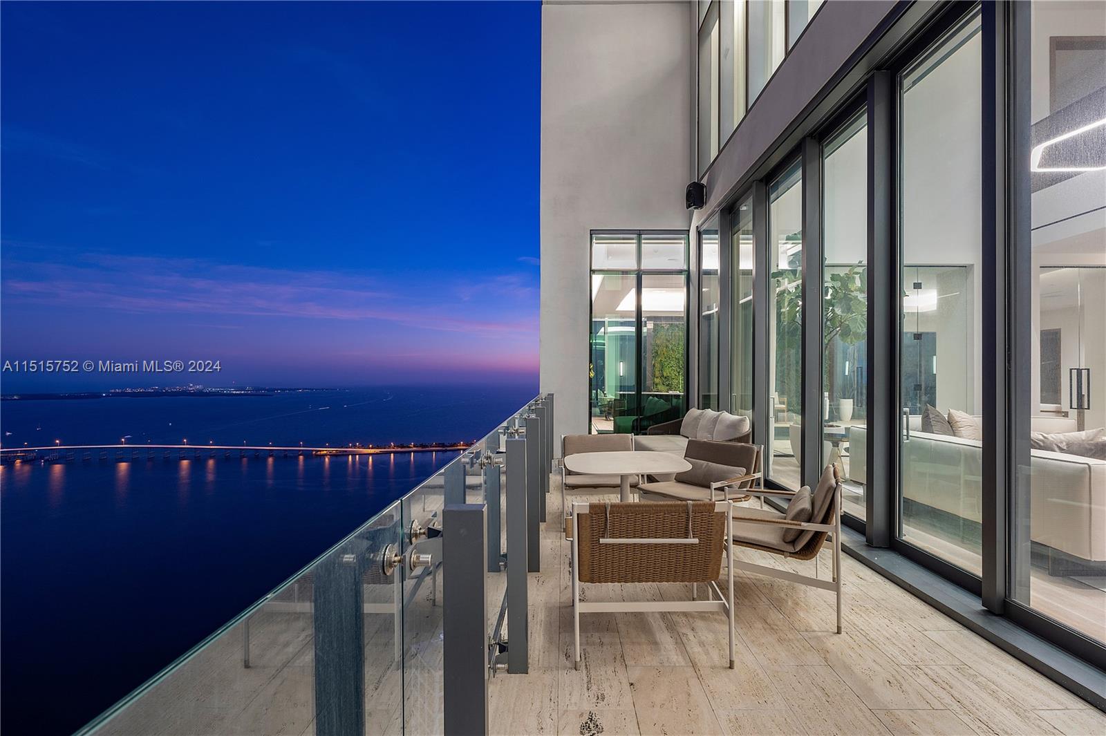 1451 Brickell Avenue, Unit PH56 Miami, FL 33131 - Photo 48 of 54 a balcony with chairs