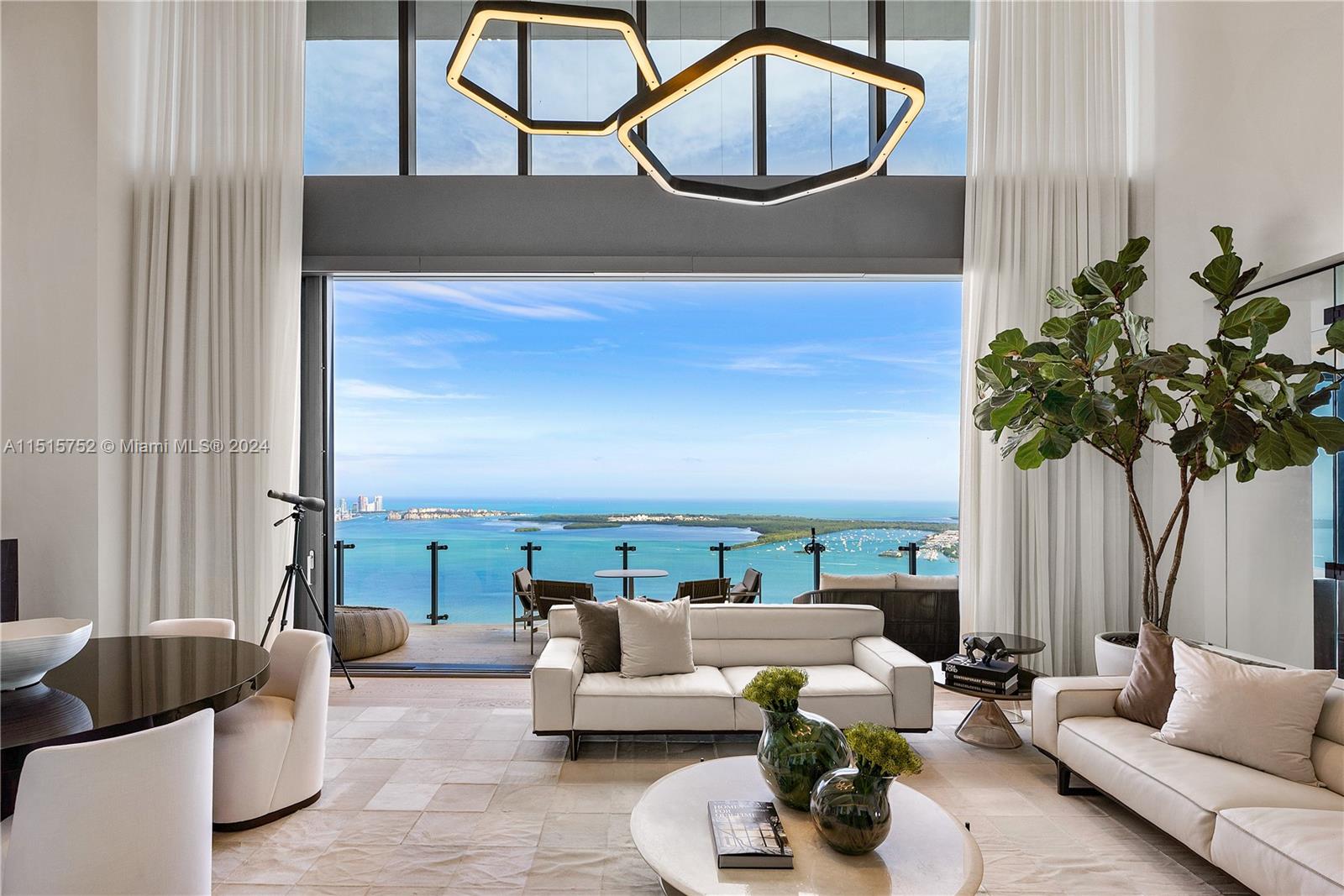 1451 Brickell Avenue, Unit PH56 Miami, FL 33131 - Photo 5 of 54 a living room with furniture flowerpot and window