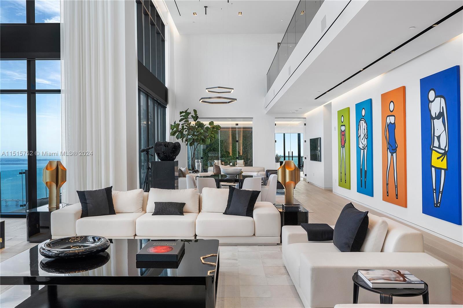 1451 Brickell Avenue, Unit PH56 Miami, FL 33131 - Photo 10 of 54 a living room with furniture and large windows