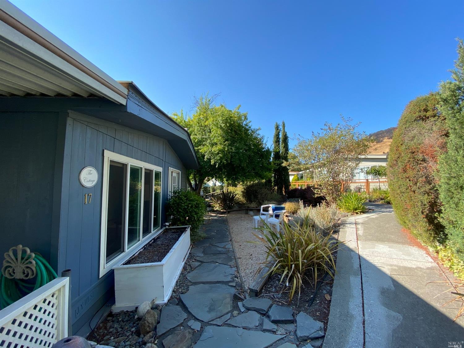 17 Shadybrook Court Santa Rosa, CA 95409 - Photo 1 of 1 Westside of the unit, with a nice yard for gardening. Leads to parks 33 acres lighted walking trails
