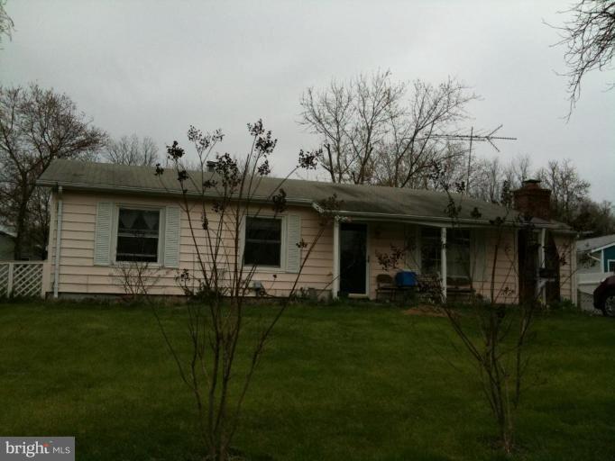 606 West Beech Road Sterling, VA 20164 - Photo 1 of 1 a front view of a house with a garden