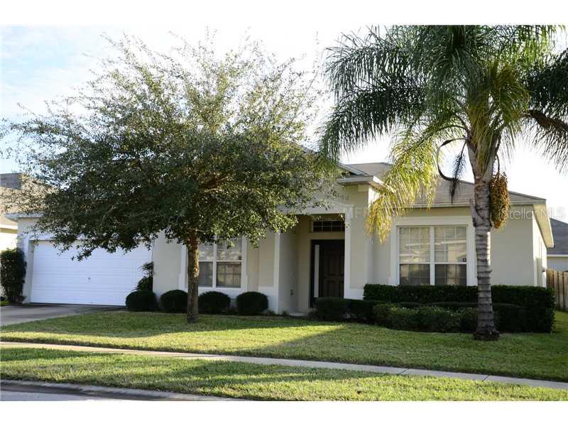 13849 Old Dock Road Orlando, FL 32828 - Photo 1 of 1 a front view of a house with a yard and potted plants